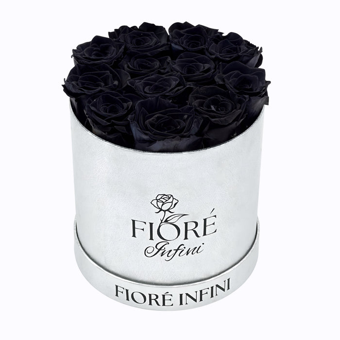 black roses in a silver box