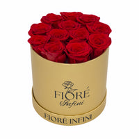 12 red roses in a round gold box