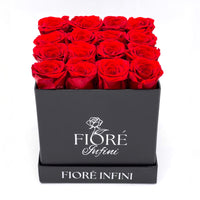 16 preserved red roses in a black square box