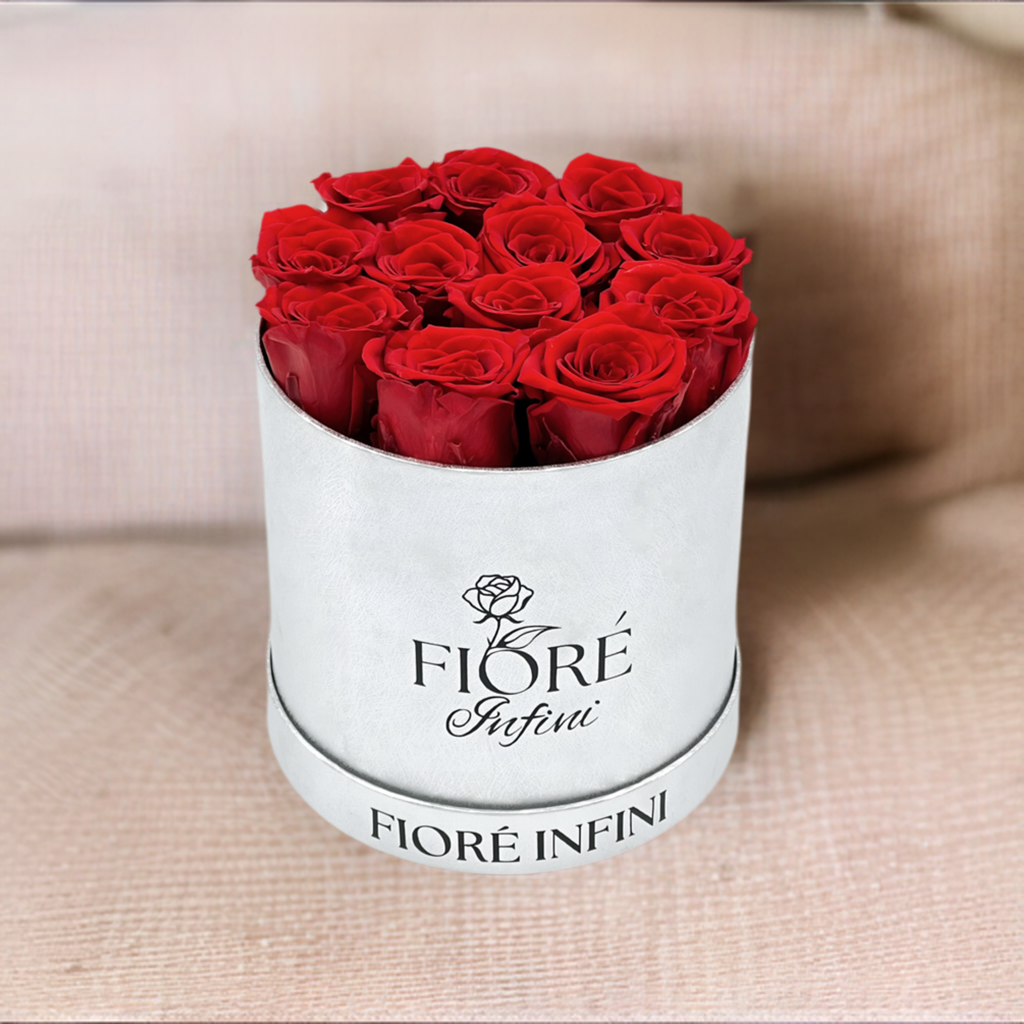 12 red forever roses in a round silver box