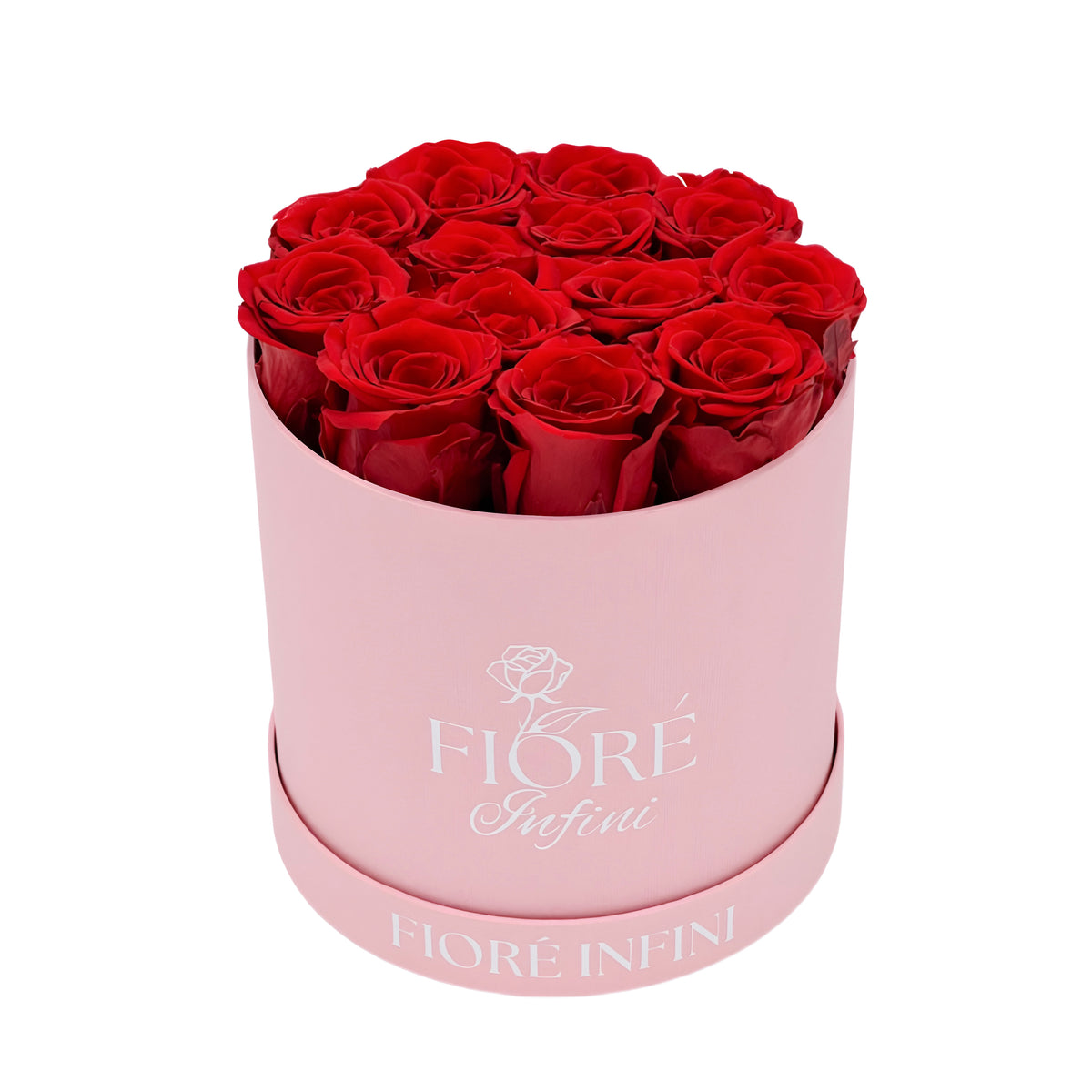 red roses in a round pink box