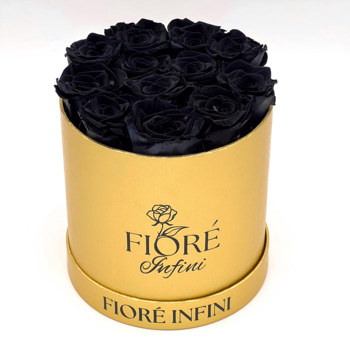 12 black forever roses in an antique gold round box