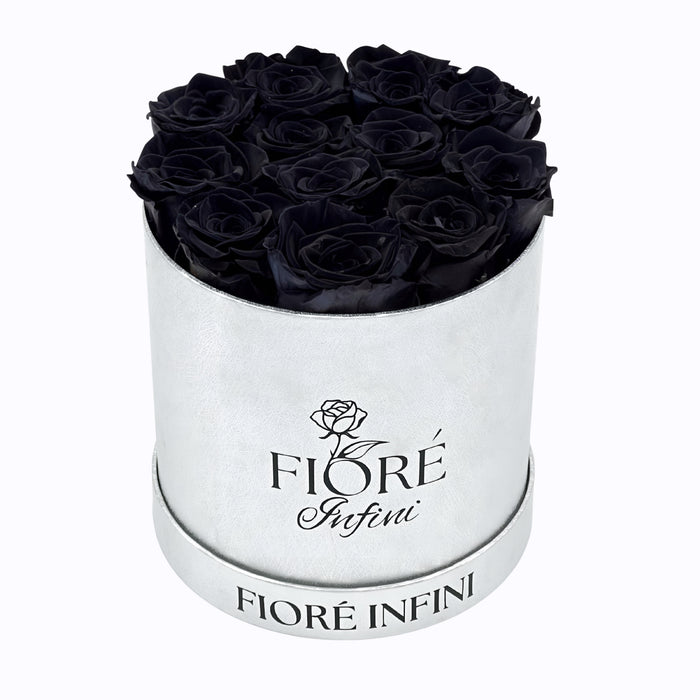 black roses in a silver box
