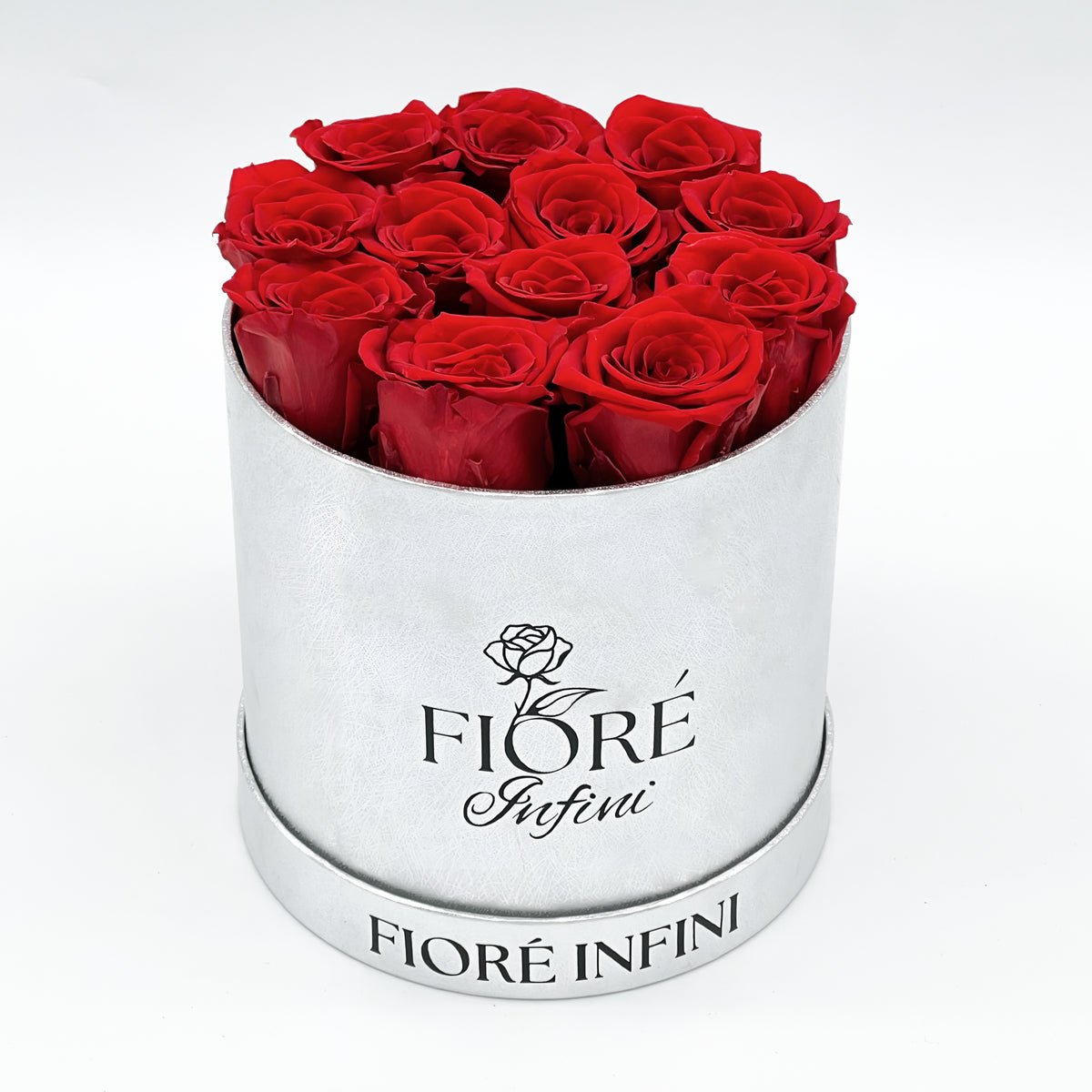 12 red forever roses in a round silver box