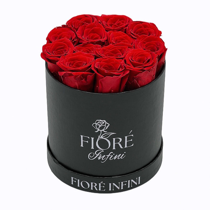 12 red forever roses in a black round box