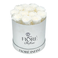 12 white preserved roses in a round silver box