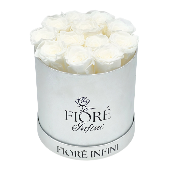 12 white preserved roses in a round silver box