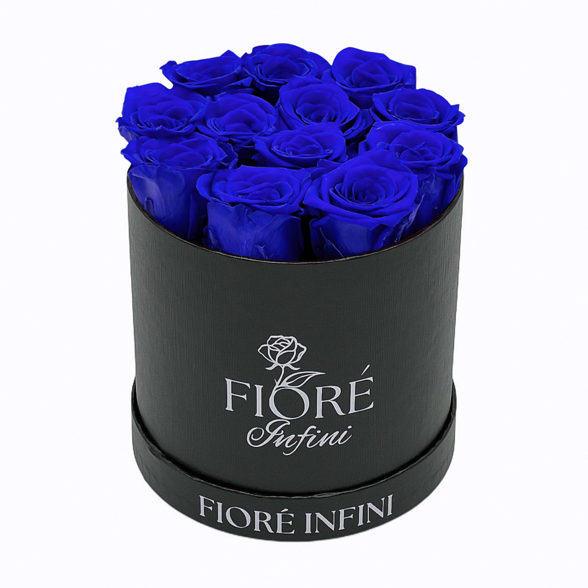 blue preserved roses in a round black box