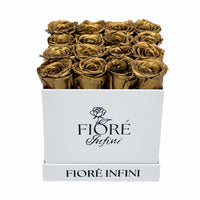 gold forever roses in a white box