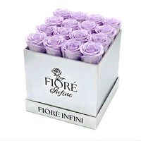 16 preserved purple roses in a silver box