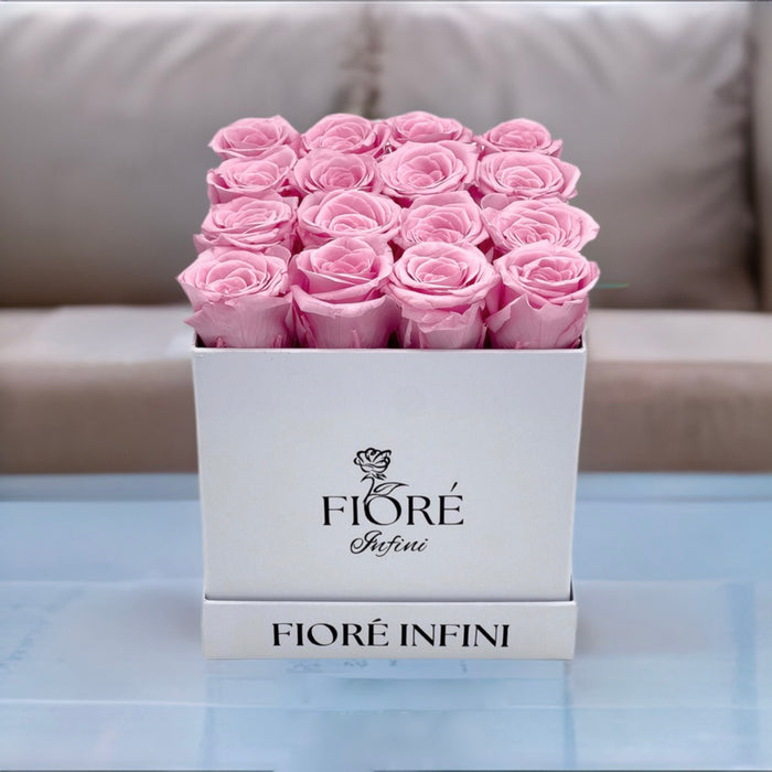 pink forever roses in a white box