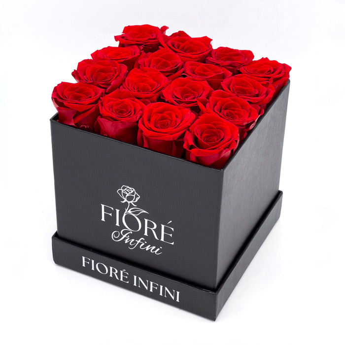16 preserved red roses in a black square box by Fiore Infini