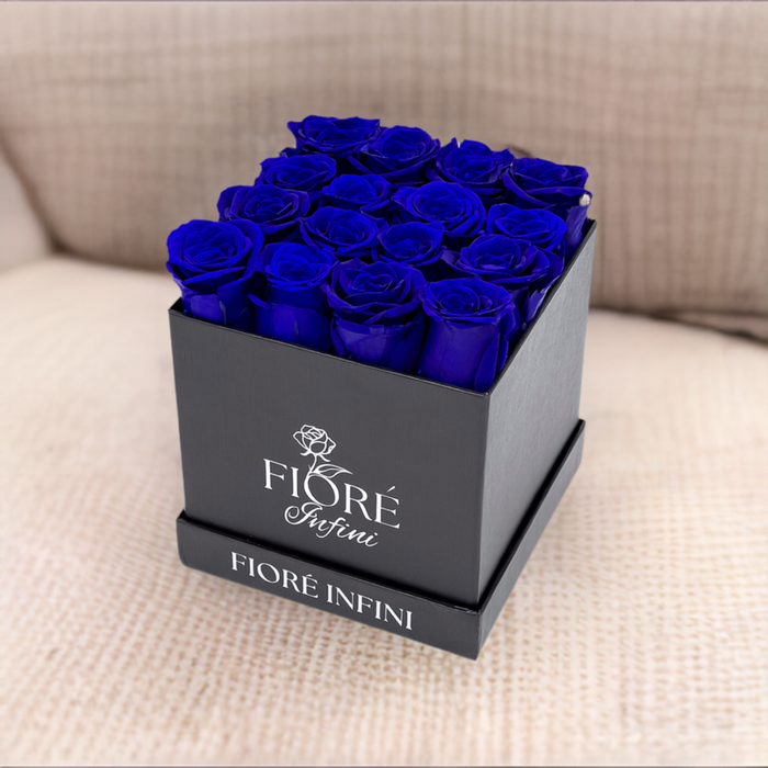 16 royal blue forever roses in a square black box
