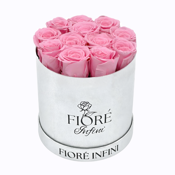 12 preserved roses in a round silver box