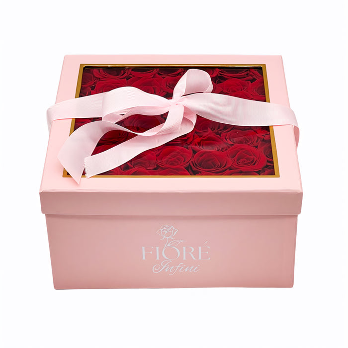 Red Forever Roses In a Large Pink Square Box