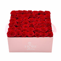 Red Forever Roses In a Large Pink Square Box