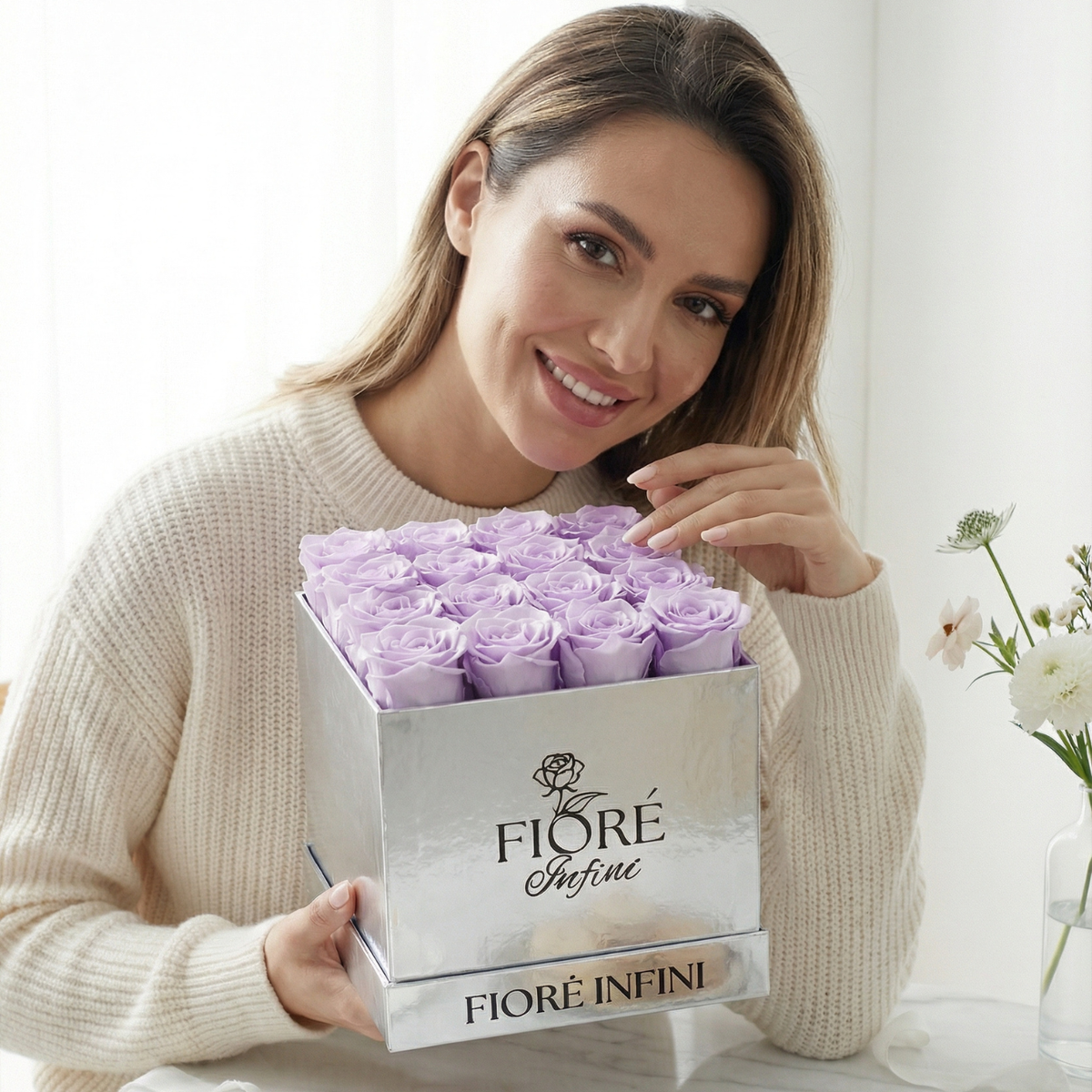 an influencer holding purple preserved rose box