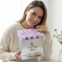 an influencer holding purple preserved rose box