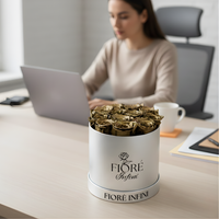 gold roses in a silver box, on a working desk