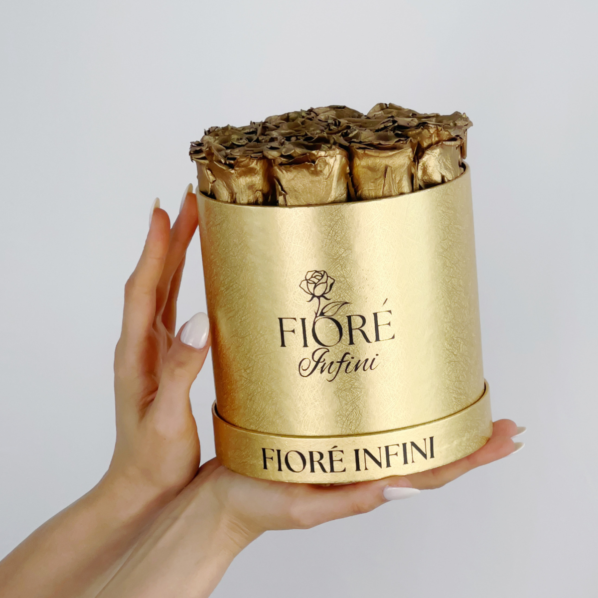 gold roses in a gold box