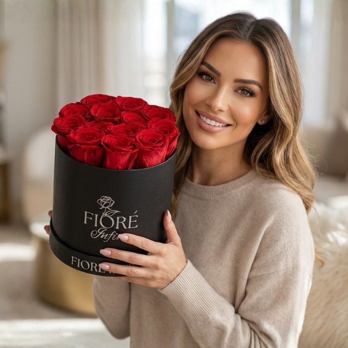 lady and a red preserved rose box