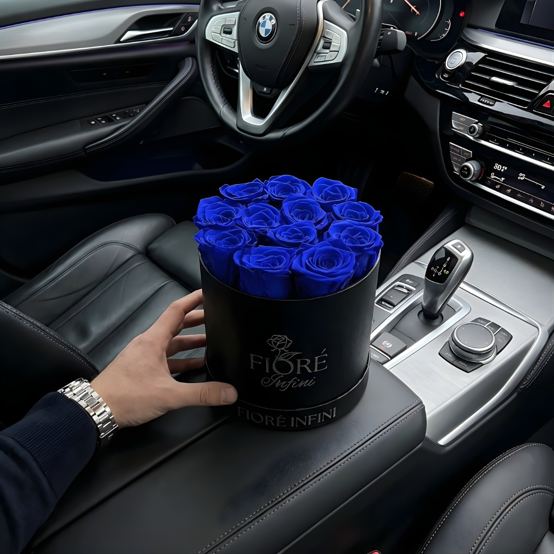 man holding luxury blue rose box