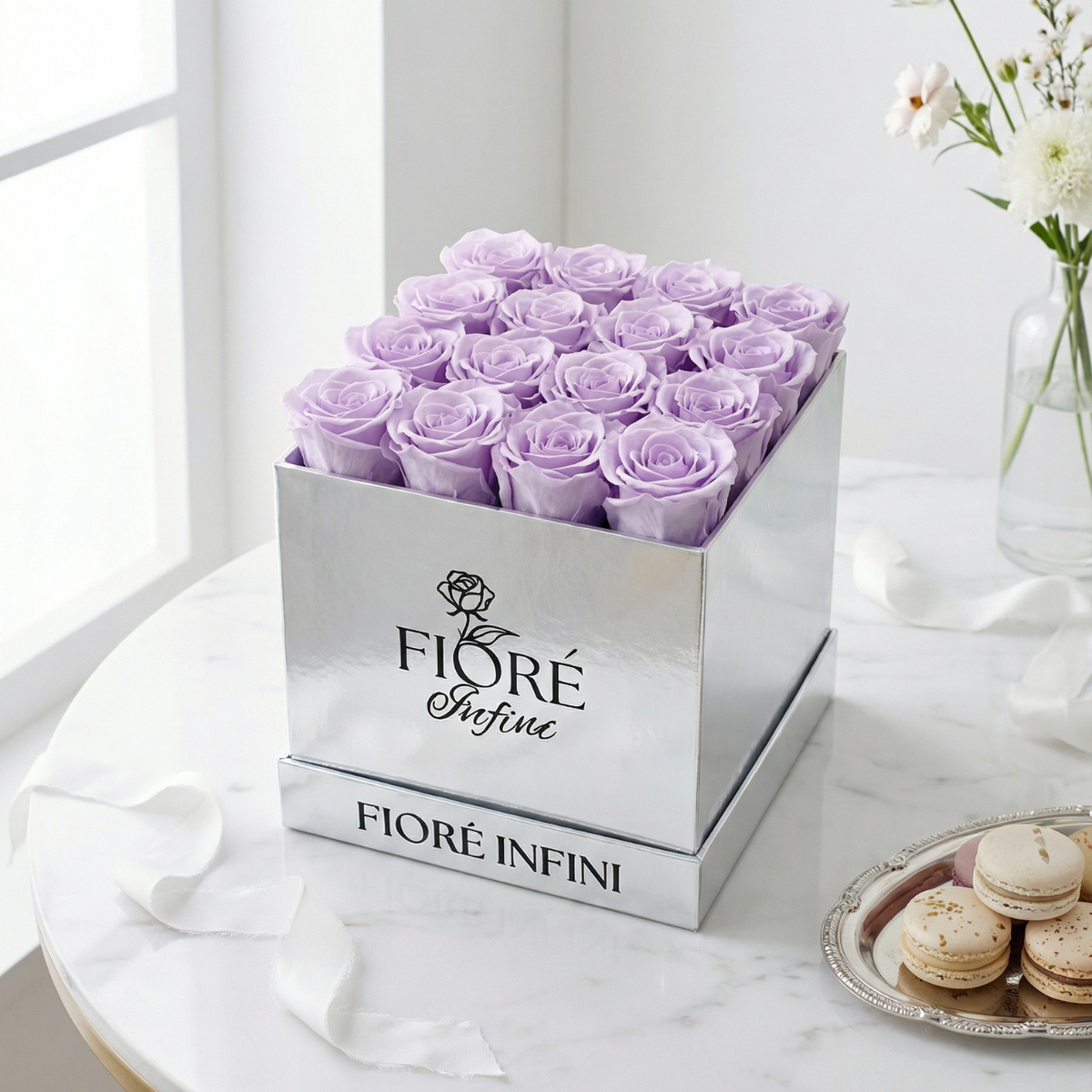 purple preserved roses in a silver box