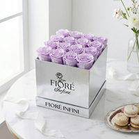purple preserved roses in a silver box