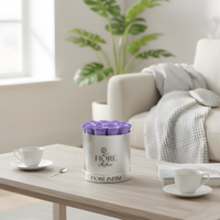 purple preserved roses in a silver box in a room