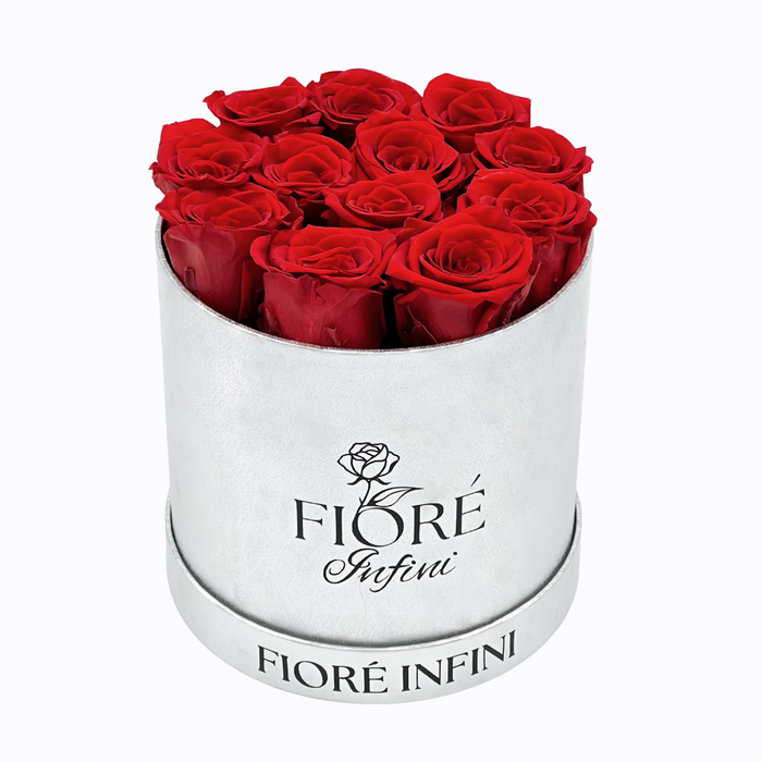 12 preserved red roses in a round silver box
