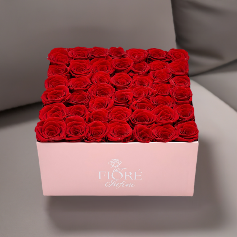 Red Forever Roses In a Large Pink Square Box